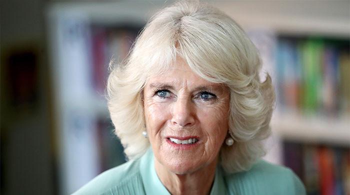 Queen Camilla shines in green as she opens new cancer centre in Bath