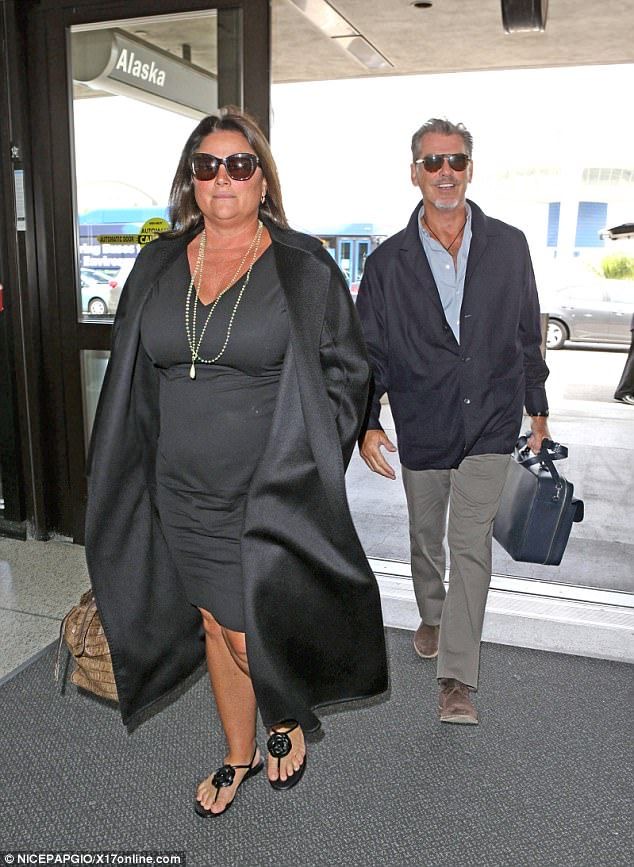 Pierce Brosnan and beloved wife Keely Shaye Smith look tanned and relaxed as they jet out of LAX following romantic Hawaii getaway